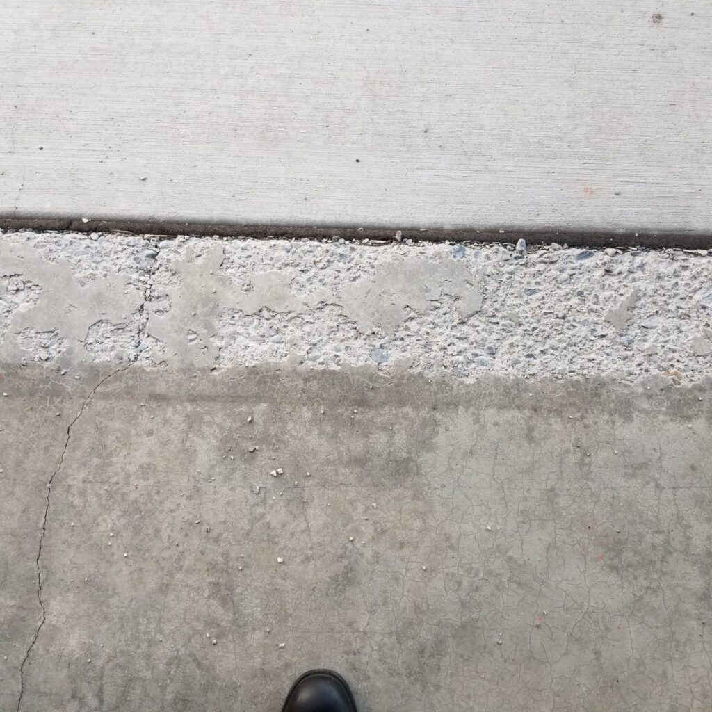 Protecting Your Garage Lip From Spalling And Deterioration: The Role Of Air Entrainment And The Power Of Polyurea Coatings 5 Garage Lip Pitting