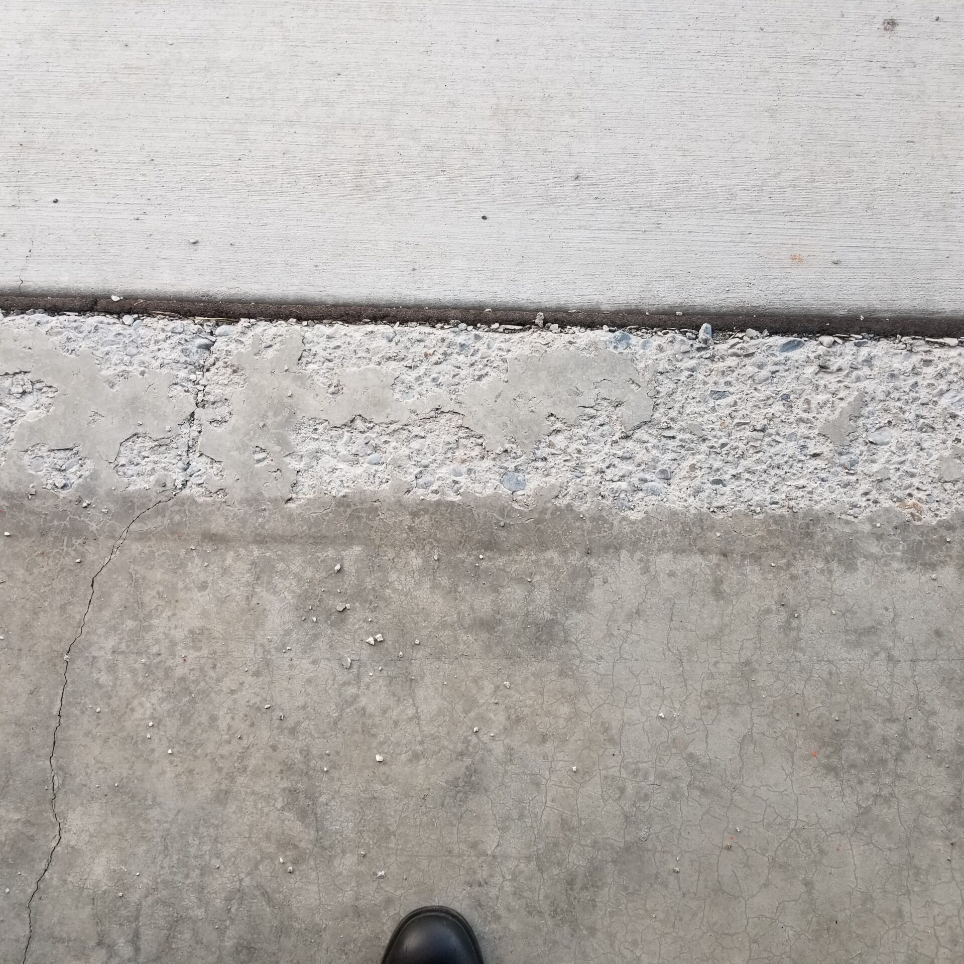 Protecting Your Garage Lip From Spalling And Deterioration: The Role Of Air Entrainment And The Power Of Polyurea Coatings 1 Garage Lip Pitting